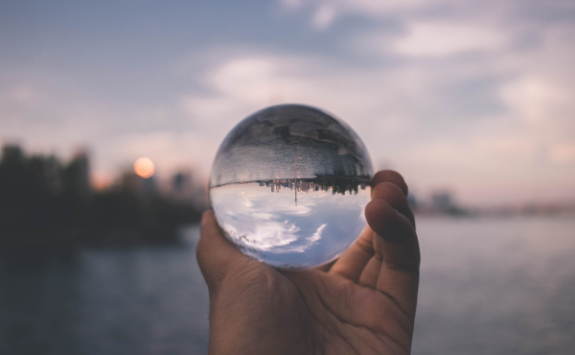 Through a glass ball, a view is turned upside down to show a new perspective